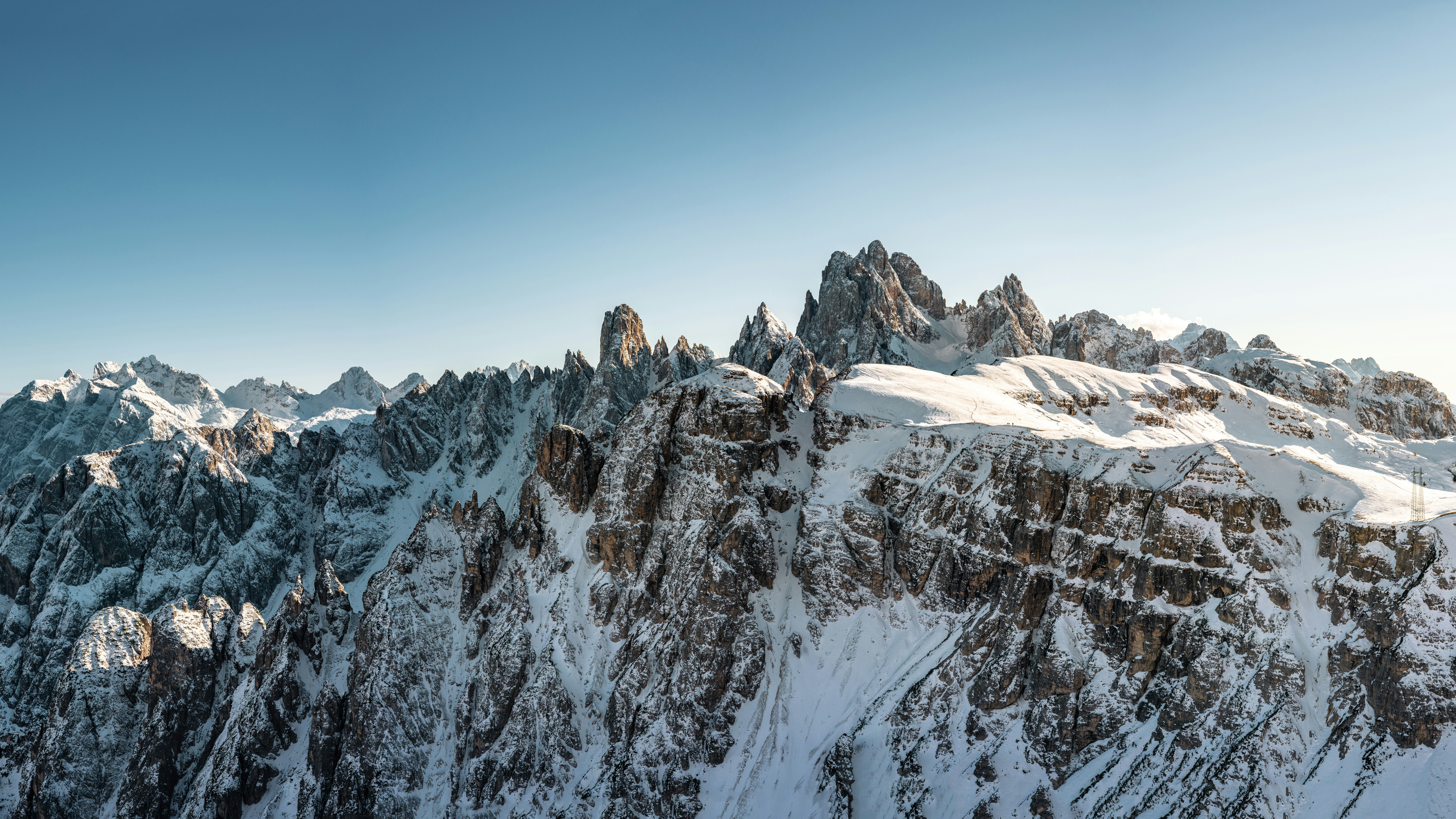 snow covered mountain under blue sky during daytime